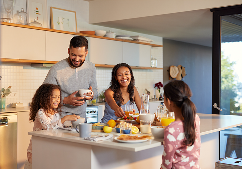 Family enjoying breakfast in their kitchen